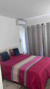 Postel nebo postele na pokoji v ubytování Apartamento Maria do Céu