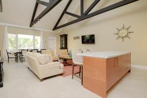 a dining room and living room with a table at Silk Cotton Villas in Nassau