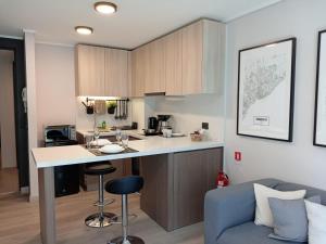 Η κουζίνα ή μικρή κουζίνα στο JC Apart Hotel Providencia