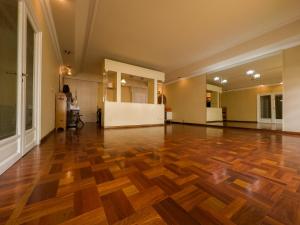 an empty room with a wooden floor in a building at Rodex Hostel Tucuman in San Miguel de Tucumán +165 photos