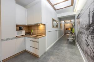 Kuchyň nebo kuchyňský kout v ubytování Amber Apartamenty