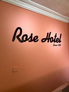 a sign on a wall with the words rosie killed at Rose Hotel in Erdemli