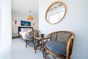 a bedroom with a bed and a table and chairs at Lily of the Valley Luxury Villa Fethiye, Yesiluzumlu by Sunworld Villas in Fethiye
