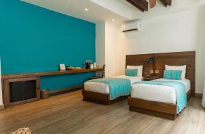 Postel nebo postele na pokoji v ubytování Sophia Hotel