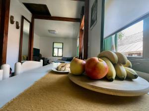 a plate of apples and bananas on a table at Kuća za odmor PEPA in Brod Moravice