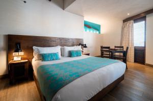 Postel nebo postele na pokoji v ubytování Sophia Hotel