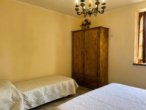 Postel nebo postele na pokoji v ubytování Casina di Desiree e Aurora