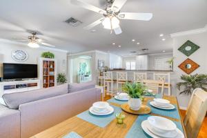 a living room with a couch and a table at Fort Myers Bungalow - 12 Miles to the Beach! in Fort Myers
