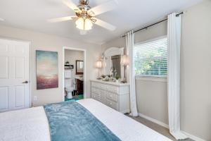 a bedroom with a bed and a ceiling fan at Fort Myers Bungalow - 12 Miles to the Beach! in Fort Myers