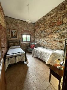 A bed or beds in a room at Agriturismo I GRANAI