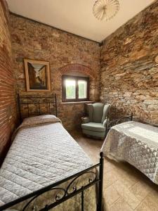A bed or beds in a room at Agriturismo I GRANAI