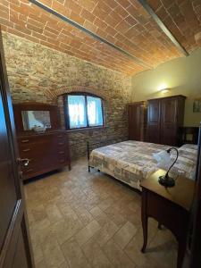 A bed or beds in a room at Agriturismo I GRANAI