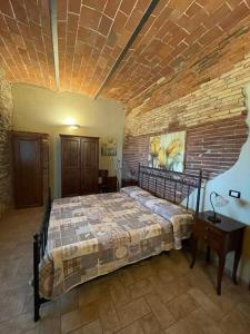 A bed or beds in a room at Agriturismo I GRANAI