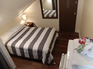 Postel nebo postele na pokoji v ubytování Cappuccio Hotel