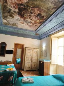 Posteľ alebo postele v izbe v ubytovaní Vittorio Emanuele Rooms di Prinzi