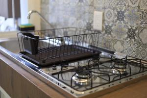 une cuisinière avec un panier dessus dans l'établissement Casa Paraiso, à Santa Cruz Huatulco