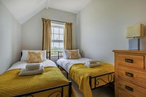 Postel nebo postele na pokoji v ubytování The Lodge