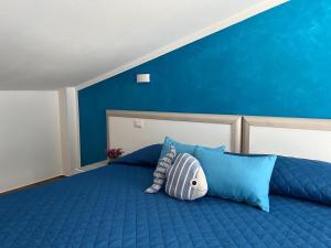 Rúm í herbergi á B&b Niu Susu