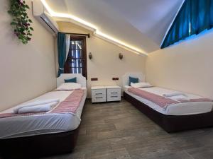 Postel nebo postele na pokoji v ubytování Kaliptus Hotel + 37 fotografií