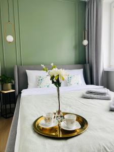 Un pat sau paturi într-o cameră la Apartament 4 Piętro