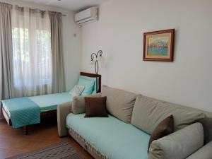 Voodi või voodid majutusasutuse Mirta Apartments Family Farm toas