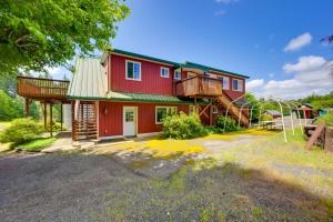 a red house with a green roof at Exceptional Chehalis Retreat with Scenic Views! in Chehalis