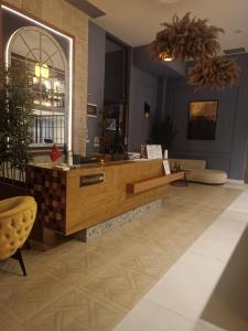 a lobby with a reception desk in a building at Invictus Hotel in Budva