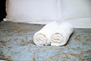 a white towel sitting on top of a table at Lagoon Staycation in Walvis Bay +23 photos