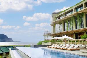 a rendering of a hotel with a pool and chairs at 1 Hotel Hanalei Bay in Princeville