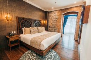 Postel nebo postele na pokoji v ubytování Hotel Otavalo