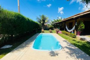 a swimming pool in the backyard of a house at CasaMares Macapá - Praia de Macapá in Macapá