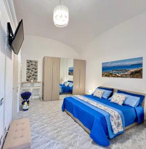 En eller flere senge i et værelse på Villino Annamaria