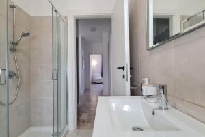 a white bathroom with a shower and a sink at FREE PARK Hapton house Big Mama - Easy to Venice in Mestre +16 photos