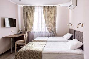 Postel nebo postele na pokoji v ubytování Time Hotel