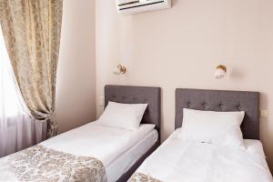 Postel nebo postele na pokoji v ubytování Time Hotel