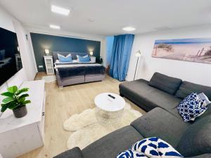 Televiisor ja/või meelelahutuskeskus majutusasutuses Ferienwohnung NAUTICA 450m zum Strand familienfreundlich