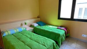 Postel nebo postele na pokoji v ubytování Portosin Casa Preciosa con vistas a la Ría de Muros y Noia