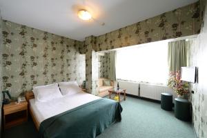 Letto o letti in una camera di Hotel Slodes