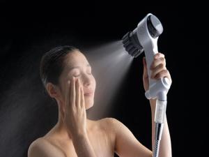 a man holding a hair dryer with his head at YADOYA Ueno-Rikyu in Tokyo
