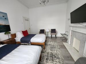 Postel nebo postele na pokoji v ubytování Morrison's Haven