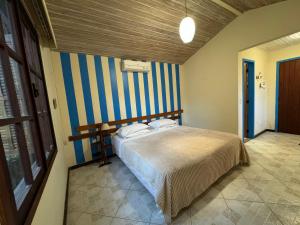Lova arba lovos apgyvendinimo įstaigoje Pousada Peninsula de Buzios