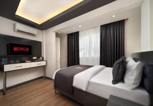 Postel nebo postele na pokoji v ubytování Bakırköy Zeugma Suit Otel