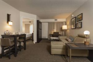 a hotel room with a couch and a living room at Residence Inn Durango Downtown in Durango