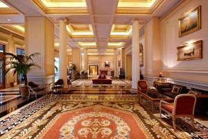 a lobby of a hotel with a large rug at Hotel Grande Bretagne, a Luxury Collection Hotel, Athens in Athens
