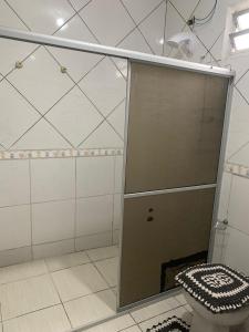 a bathroom with a shower stall with a toilet at AP próximo ao aeroporto, praia, porto e Beto carrero in Navegantes