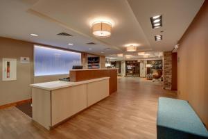 an office lobby with a reception desk and a large window at Fairfield Inn Boston Tewksbury/Andover in Tewksbury