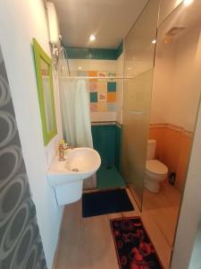 a bathroom with a sink and a toilet at Apartment Thamrin City 1 Bedroom near Tanah Abang in Jakarta