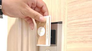 a person unlocking a door with a hand on it at Priority Kalimantan Samarinda in Samarinda +15 photos