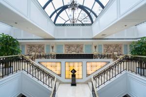 a view of the lobby of a building with a chandelier at Jin Jiang Hotel in Shanghai