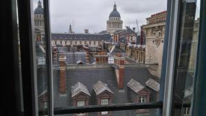 a view of a city from a window at Hotel Cluny Sorbonne in Paris